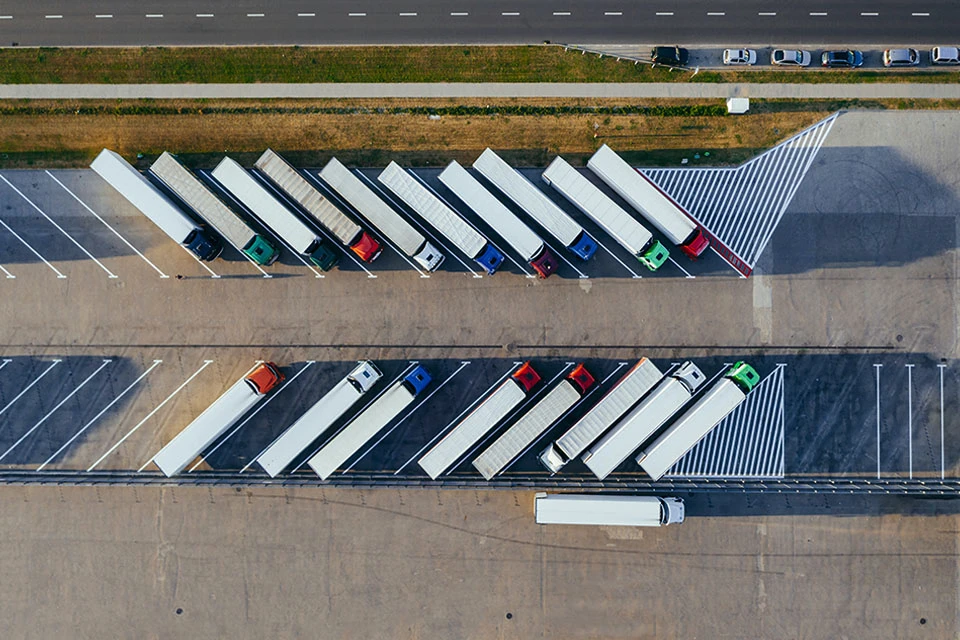 Top-down image of a variety of trucks parked in a parking lot